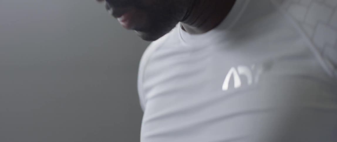 A man stops to take a breath while working out