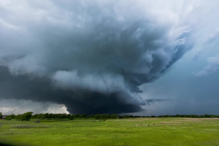 Storm clouds form over a field