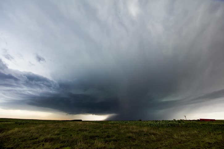 Storm clouds form over a field