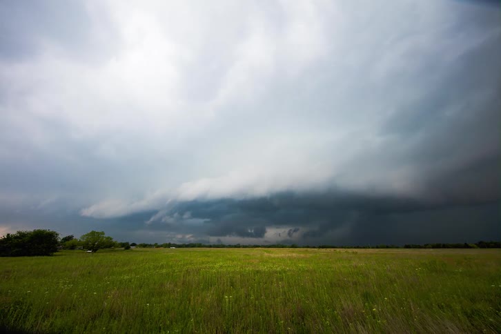Storm clouds form over a field