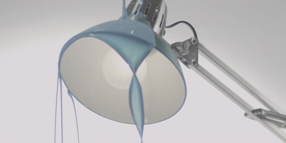 Paint pours onto a metal lamp