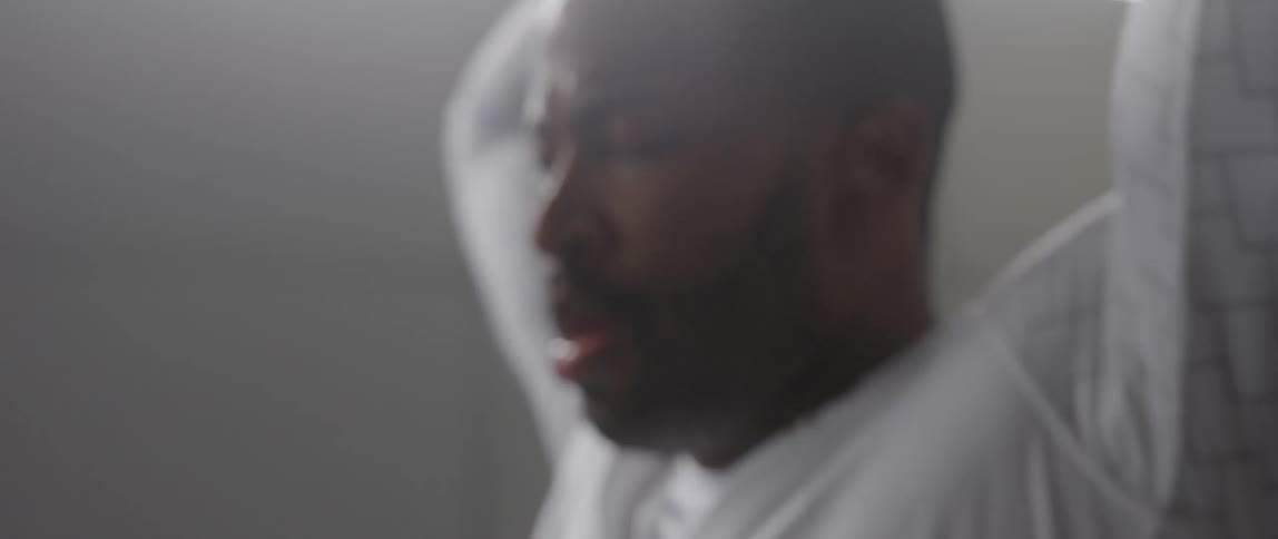 Man sweating and stretching his arms