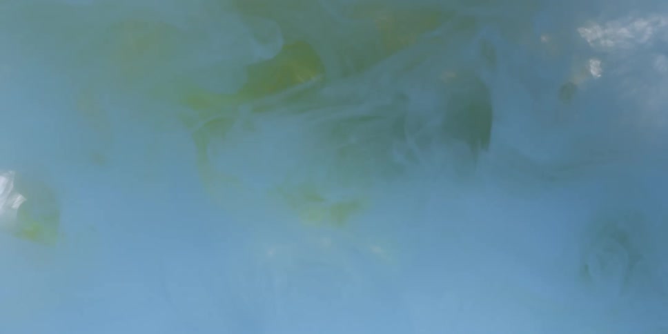 Colors and light blend as smoke drifts in abstract