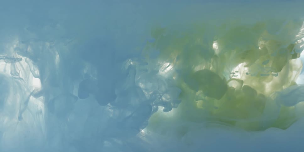 Colorful dye flows and swirls in water