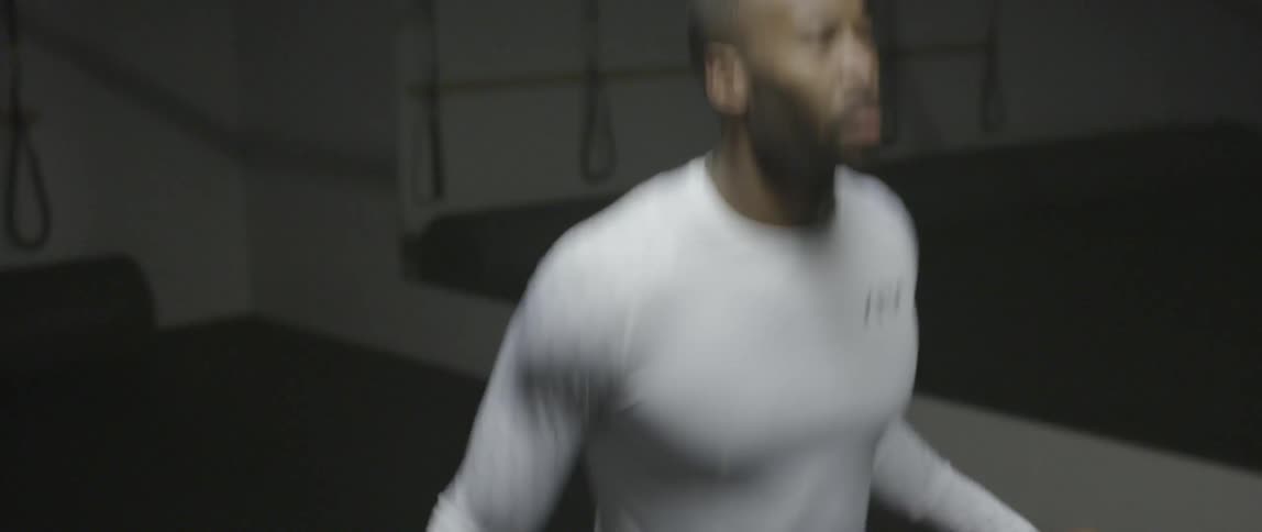 A man is working out using a jump rope