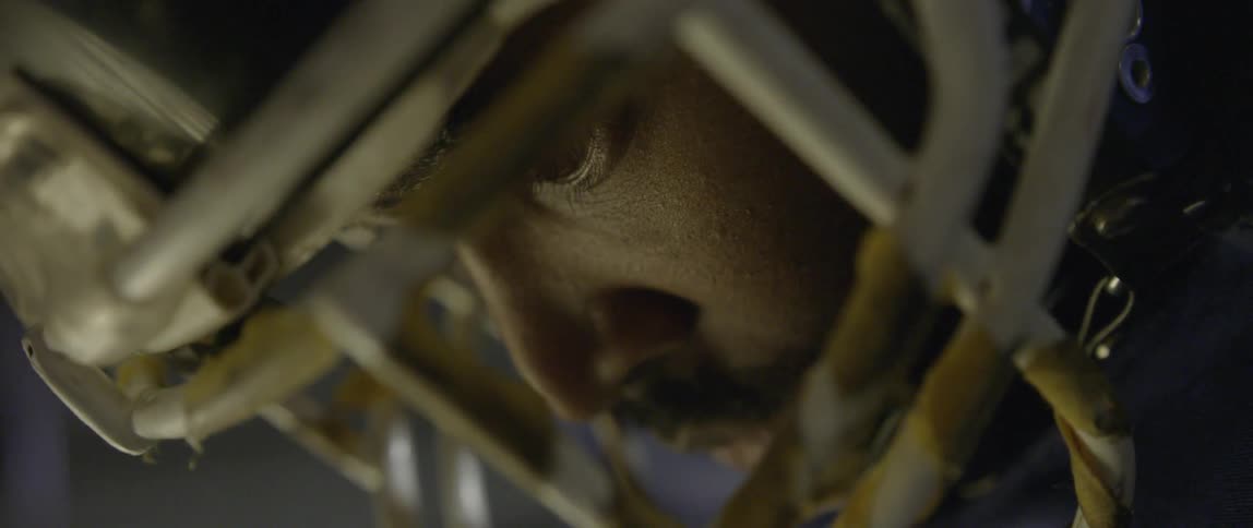 Man looking down with a face mask