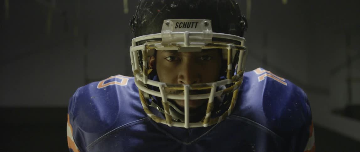A football player raises his head