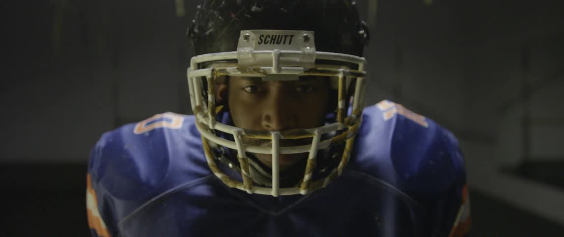 A football player has his helmet on