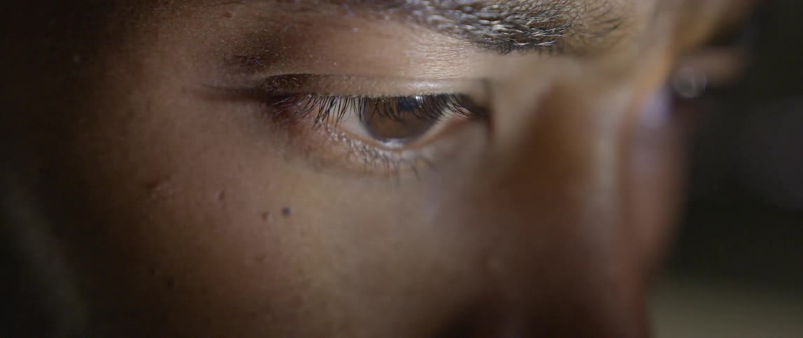 Light is moving around a man's face