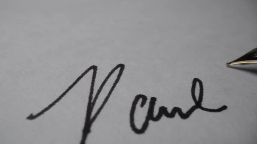 Metal fountain pen is used to write signature