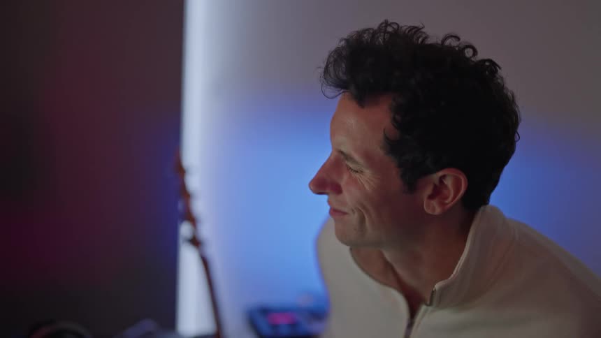 A man is playing the guitar
