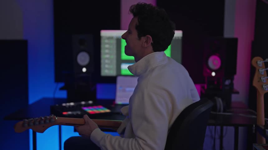 A man is playing the guitar