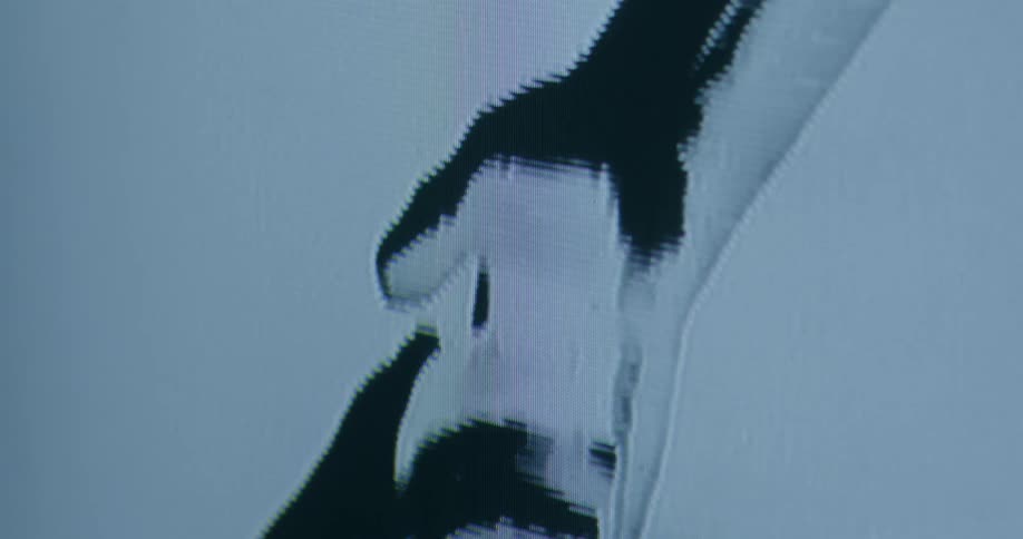 Lines streak down digital display showing drawing of touching hands
