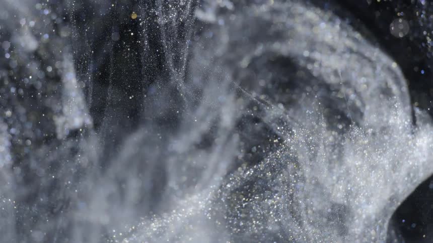 silver crystalline liquid moves and spreads in water