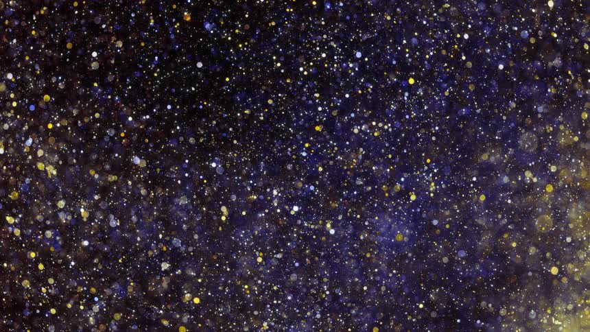 The glitter is reflecting light like a sky with millions of planets
