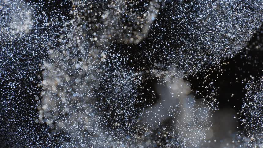 The explosion spreads debris