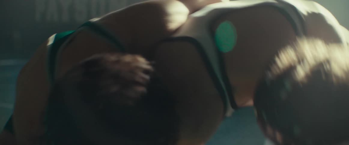 Two people are wrestling with each other