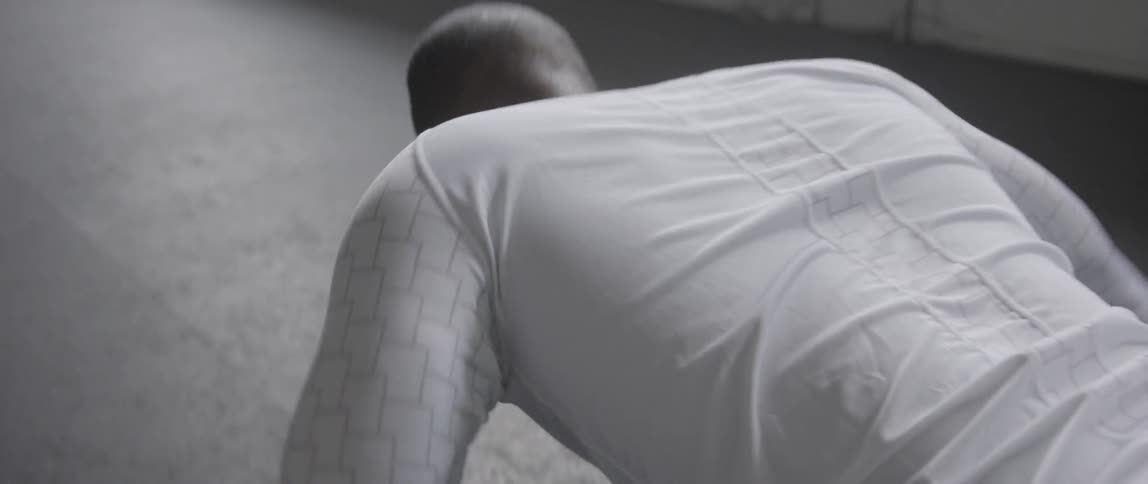 Man does push ups indoors