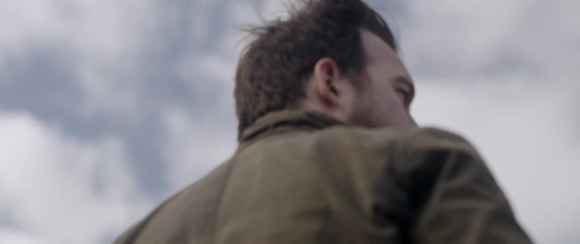 Man is standing outside on cloudy day