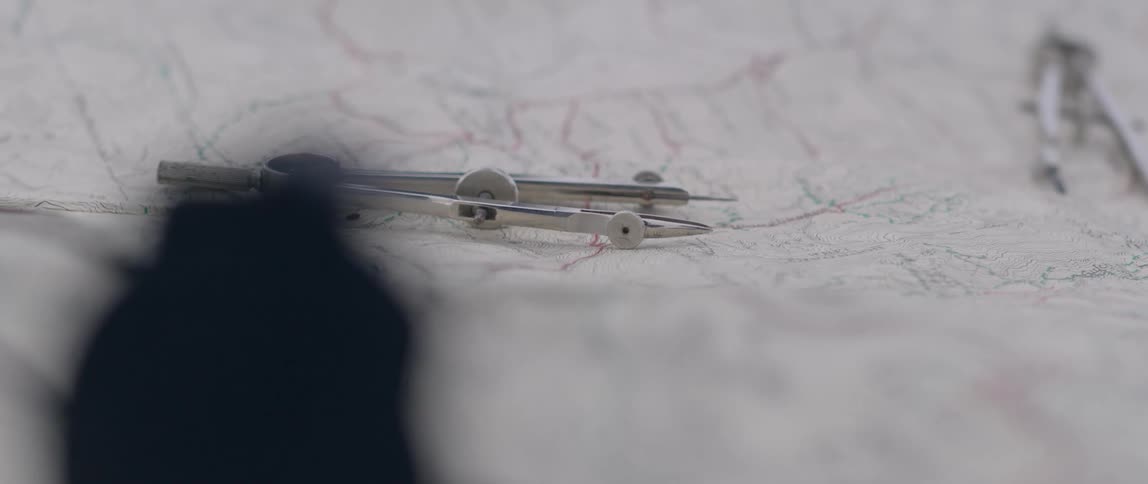 A compass on top of a map