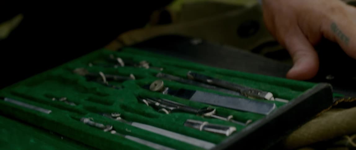A man looks through tools