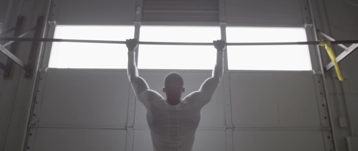 A man is doing pull ups