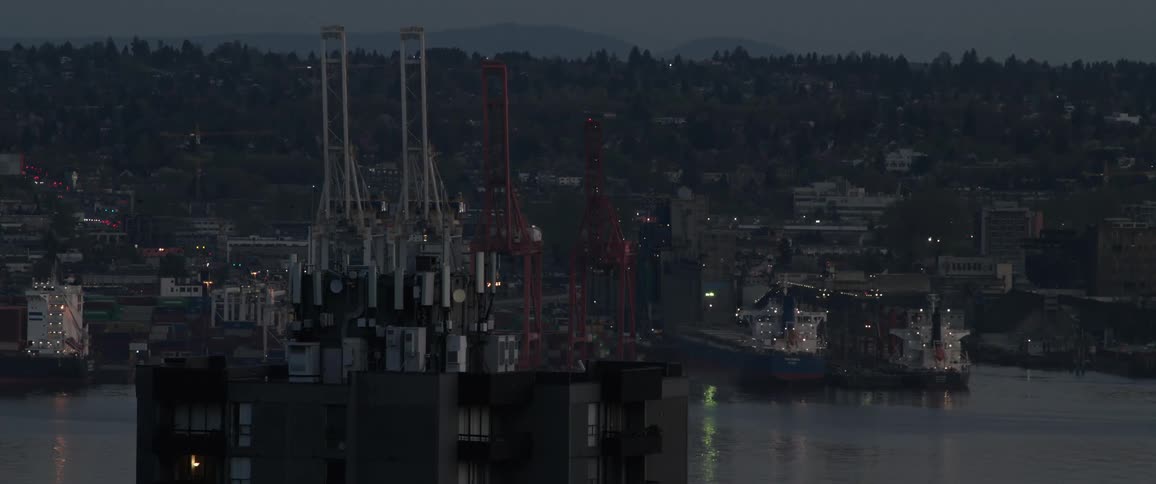 Lights flash on the port at sunset