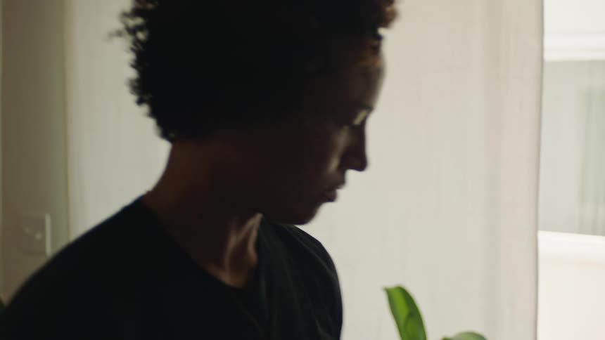 Woman analyzing a surfboard indoors