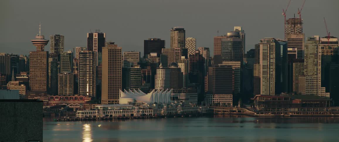 A still shot of a city on the waterfront and many tall buildings