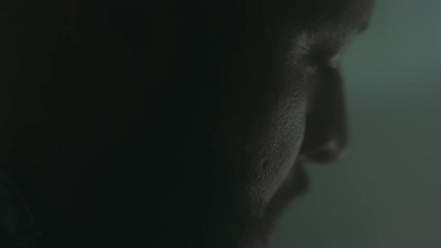 Man looking down shaking his head