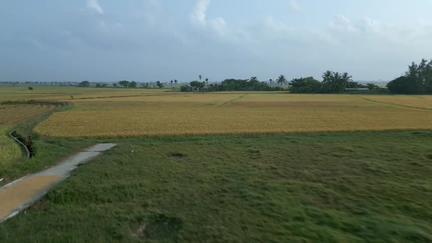 Aerial sweeping across agricultural land in the countryside