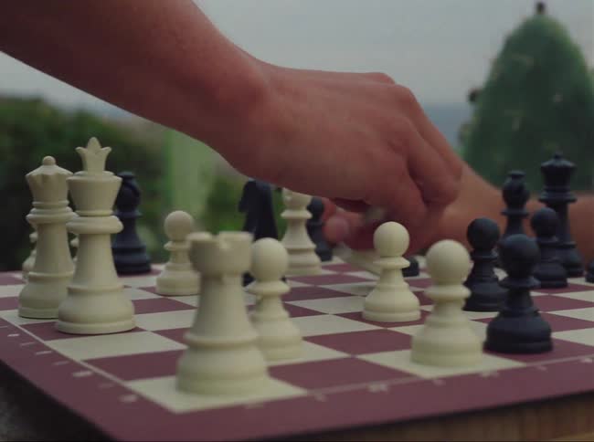 Two people are playing chess