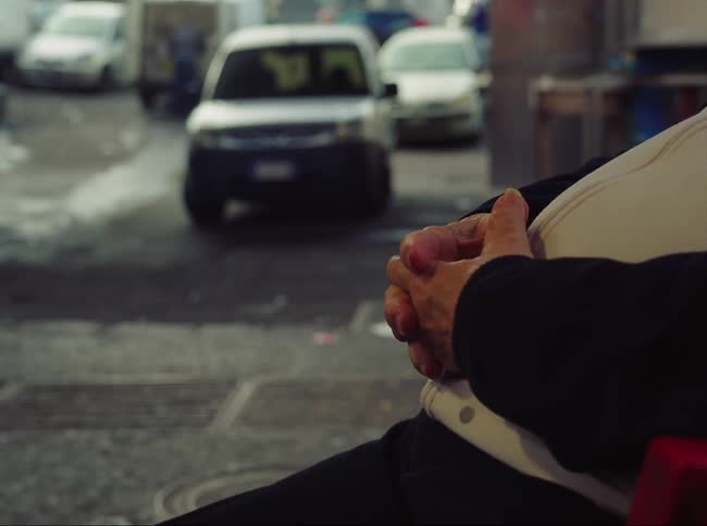 Hands clasped with fingers moving fast