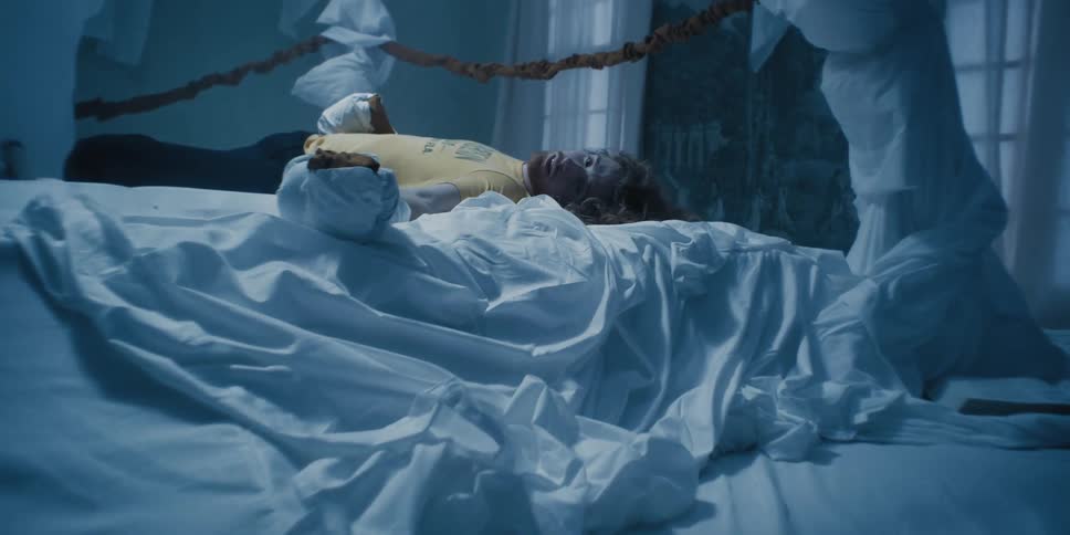 A man is laying on the bed