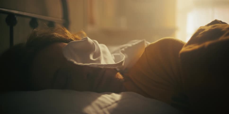 Sheet slowly covering mans face and the retreating as hes sleeping near dawn