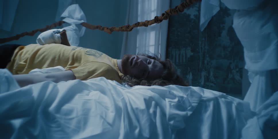 A man is resting in bed
