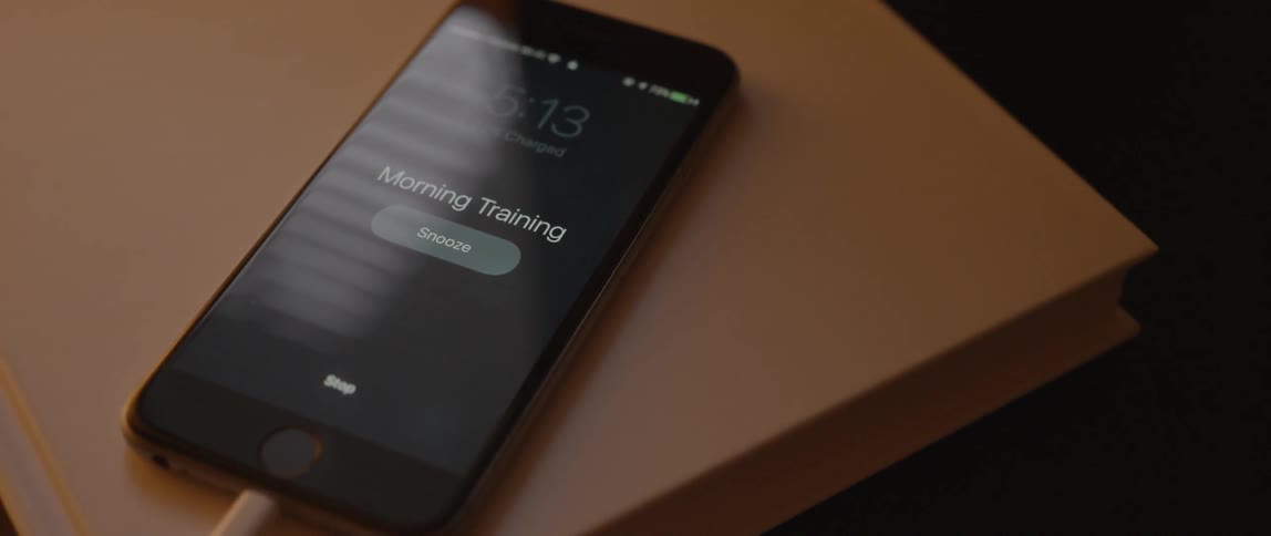 An alarm lights on a phone saying morning training