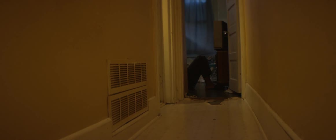 A man is doing sit ups in the doorway