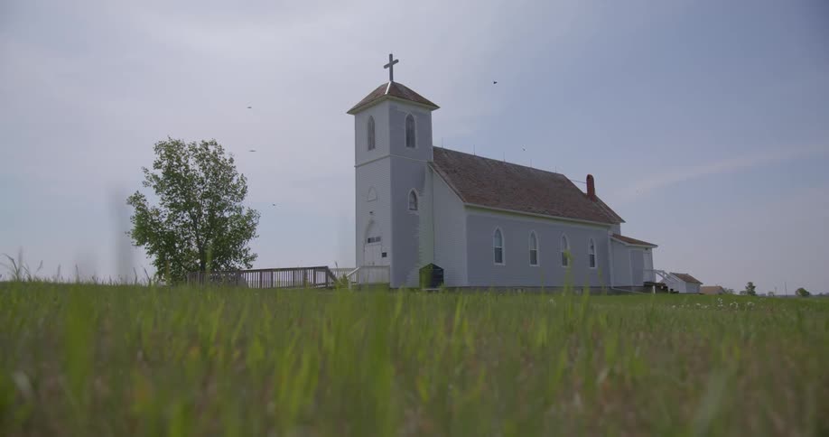 A church in a field in the countryside during the day
