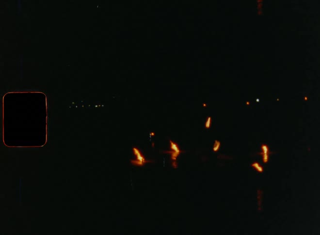 Nighttime fire spinning performance with circular motion