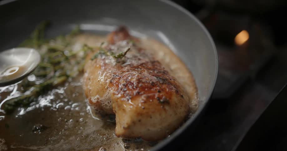 The view is of a portrait of someone that is cooking food