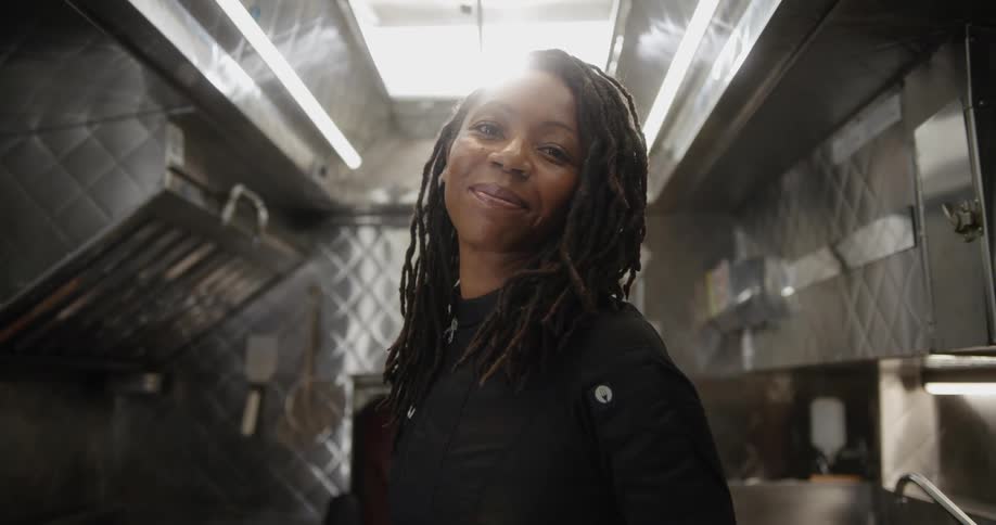 Black woman chef inside the kitchen of a food truck