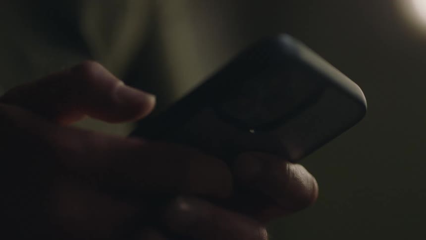 Close up view of a person texting on their phone