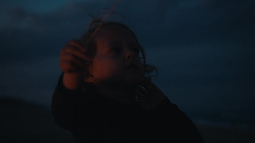 Children wave sparklers around