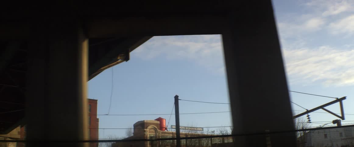 A bridge moves over to some buildings