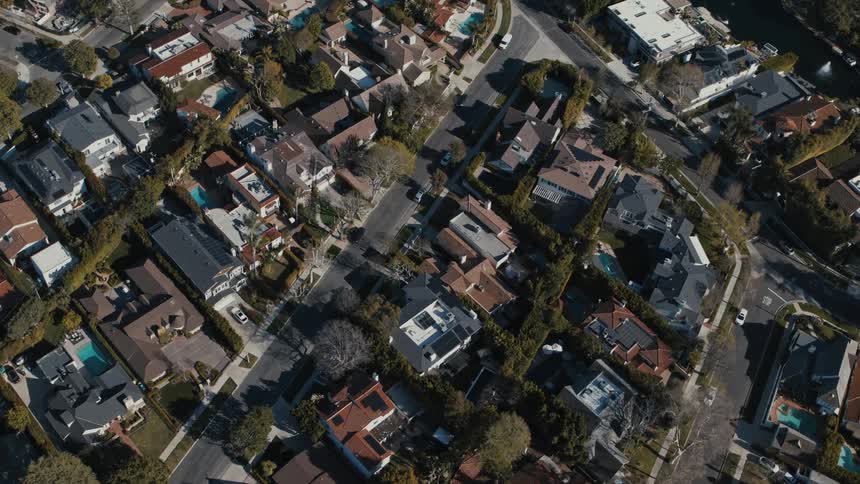 A dense Los Angeles suburban neighborhood enjoys a sunny day