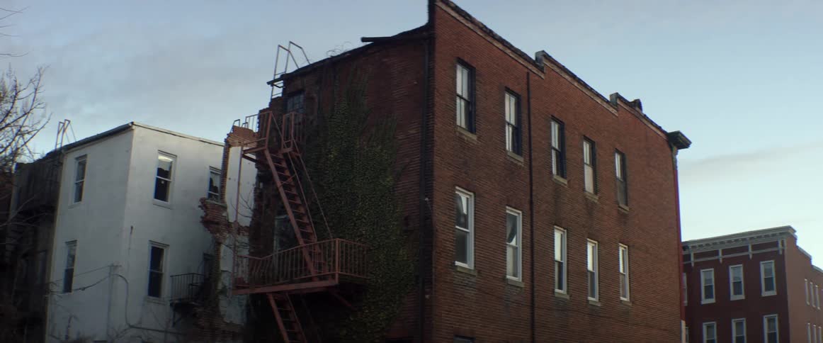 A brick building has a fire escape