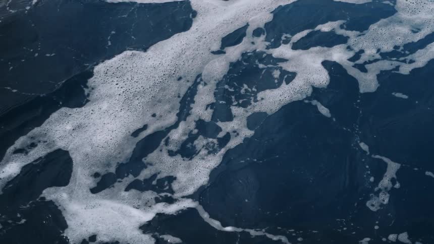 Mildly rough sea with foamy waves