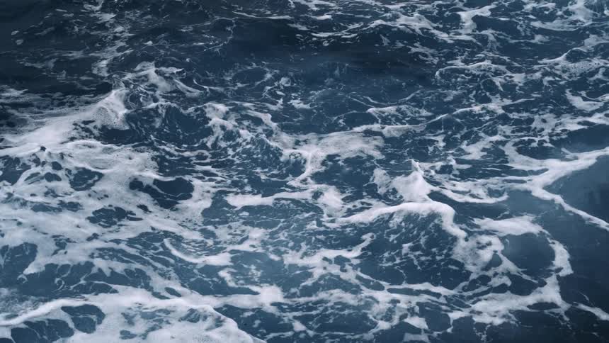 Close up view of ocean waves is displayed