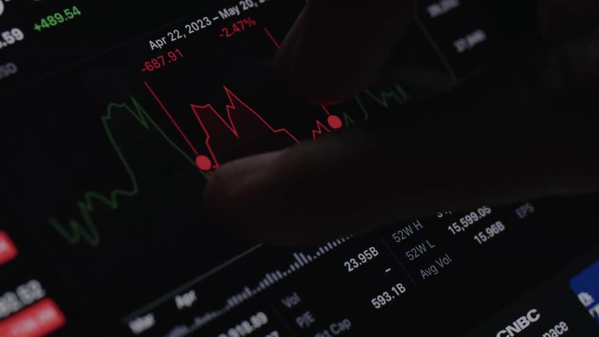 Close up view of a person looking at stocks